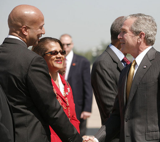 President George W. Bush is greeted by New Orleans Mayor Ray Nagin and his wife, Seletha Smith Nagin, on his arrival to Louis Armstrong New Orleans International Airport Monday, April 21, 2008, where President Bush will attend the 2008 North American Leaders' Summit. White House photo by Joyce N. Boghosian
