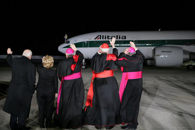 Vice President Dick Cheney and Mrs. Lynne Cheney are joined by clergy as they wave to the departing Alitalia airliner carrying Pope Benedict XVI from JFK Airport Sunday, April 20, 2008, in New York. The Pope later landed safely in Rome, capping a six-day visit to the United States. White House photo by David Bohrer