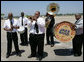 Members of the Preservation Hall Jazz Band are seen on the tarmac at Louis Armstrong New Orleans International Airport Monday, April 21, 2008, offering a musical welcome for North American leaders President George W. Bush, Mexico President Felipe Calderon and Canadian Prime Minister Stephen Harper at their arrivals to attend the 2008 North American Leaders’ Summit. White House photo by Chris Greenberg
