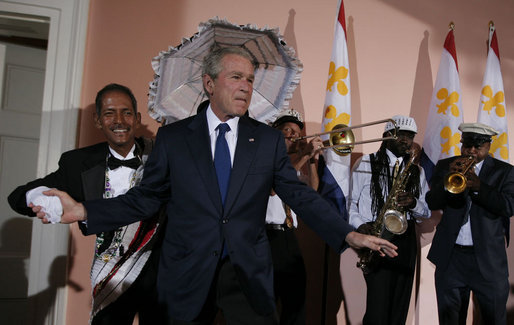 President George W. Bush steps on stage at the U.S. Chamber of Commerce reception to join members of the Euphonic Jazz Band Monday evening, April 21, 2008, prior to attending the 2008 North American Leaders’ Summit dinner in New Orleans. White House photo by Joyce N. Boghosian
