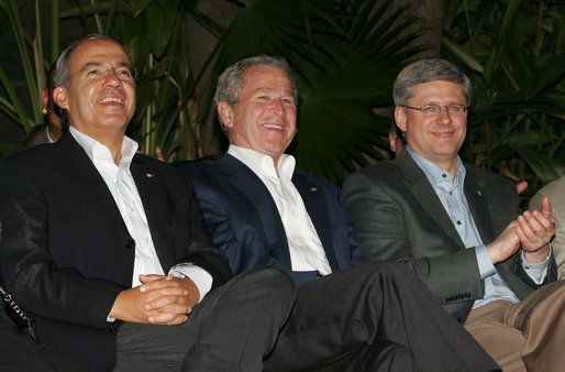 President George W. Bush joins Mexico’s President Felipe Calderon and Canadian Prime Minister Stephen Harper, right, as they listen to a jazz band at the Commander’s Palace restaurant Monday evening, April 21, 2008, after attending the North American Leaders’ Summit dinner in New Orleans. White House photo by Joyce N. Boghosian