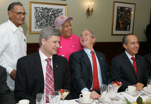President George W. Bush thanks Dooky Chase's restaurant owners Leah and Dooky Chase Tuesday morning, April 22, 2008 in New Orleans, where President Bush hosted a breakfast meeting with President Felipe Calderon of Mexico and Canadian Prime Minister Stephen Harper during the final day of the 2008 North American Leaders' Summit. White House photo by Joyce N. Boghosian