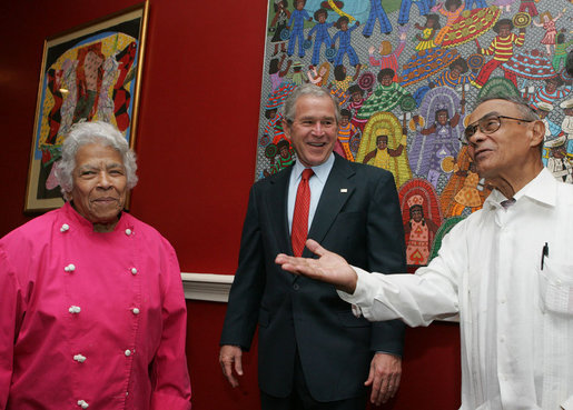 President George W. Bush is welcomed to Dooky Chase's restaurant Tuesday morning, April 22, 2008 in New Orleans, by owners Leah and Dooky Chase, where President Bush hosted a breakfast meeting with President Felipe Calderon of Mexico and Canadian Prime Minister Stephen Harper during the final day of the 2008 North American Leaders' Summit. White House photo by Joyce N. Boghosian