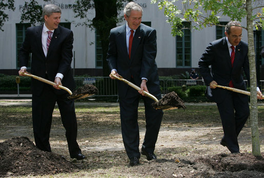 President George W. Bush, Canadian Prime Minster Stephen Harper and Mexico’s President Felipe Calderon carry shovels of dirt at a tree planting ceremony in honor of Earth Day Tuesday, April 22, 2008 at Lafayette Square in New Orleans. White House photo by Chris Greenberg