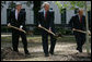 President George W. Bush, Canadian Prime Minster Stephen Harper and Mexico’s President Felipe Calderon carry shovels of dirt at a tree planting ceremony in honor of Earth Day Tuesday, April 22, 2008 at Lafayette Square in New Orleans. White House photo by Chris Greenberg