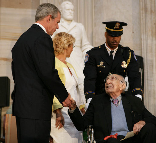 President George W. Bush offers his hand to Dr. Michael DeBakey Wednesday, April 23, 2008, after honoring the 99-year-old pioneer of bypass heart surgery during the Congressional Gold Medal Ceremony at the U.S. Capitol. White House photo by Chris Greenberg