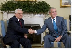 President George W. Bush shakes hands with President Mahmoud Abbas as they meet with the media Thursday, April 24, 2008, in the Oval Office of the White House.  White House photo by Chris Greenberg