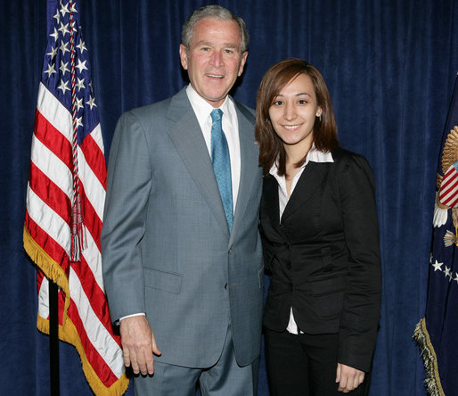 President George W. Bush stands backstage with Yadira Vieyra, a Georgetown University student, who was among those in attendance Thursday, April 24, 2008, at the White House Summit on Inner-City Children and Faith-Based Schools. The President mentioned Yadira in his remarks to the summit, saying: ".Let me end with a story here about Yadira Vieyra. Yadira says she goes to Georgetown University, and she said -- I was asking if Yadira was going to be here so I could ask her to stand here in a minute, and a fellow told me she's a little worried about missing class. So whoever Yadira's teacher is, please blame it on me, not her." White House photo by Chris Greenberg