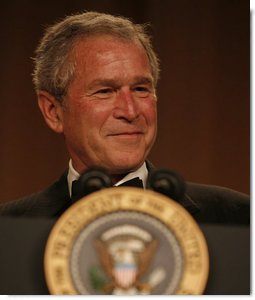 President George W. Bush smiles as he delivers remarks Saturday evening, April 26, 2008, during the White House Correspondents' Association Dinner at the Washington Hilton Hotel. White House photo by Joyce N. Boghosian