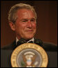 President George W. Bush smiles as he delivers remarks Saturday evening, April 26, 2008, during the White House Correspondents' Association Dinner at the Washington Hilton Hotel. White House photo by Joyce N. Boghosian