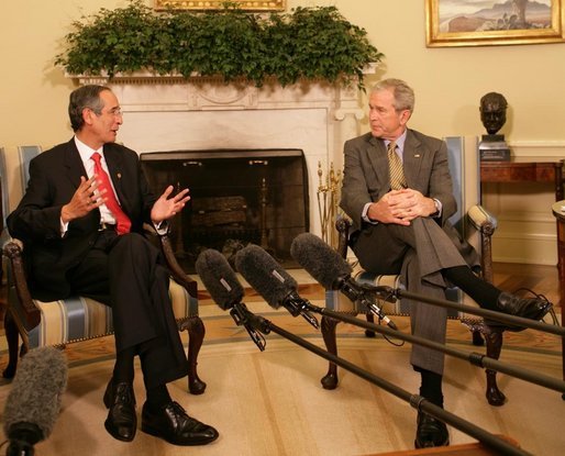 President George W. Bush listens to remarks by President Alvaro Colom Monday, April 28, 2008, in the Oval Office during a visit the Guatemalan leader and his wife to the White House. White House photo by Chris Greenberg