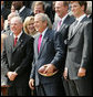 President George W. Bush smiles as he holds a football presented to him by New York Giants Coach Tom Coughlin and Quarterback Eli Manning Wednesday, April 30, 2008, during an event on the South Lawn celebrating the Giants 17-14 Super Bowl win in February. White House photo by Chris Greenberg