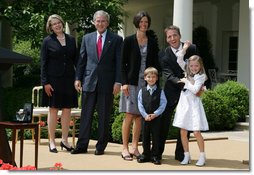 President George W. Bush and Secretary of Education Margaret Spellings join Mike Geisen, the 2008 National Teacher of the Year, and his family as they celebrate the 7th grade teacher's honors Wednesday, April 30, 2008, in the Rose Garden of the White House. Family members include Mr. Geisen's wife, Janet, and their children, Johanna, 8, and Aspen, 6.  White House photo by Joyce N. Boghosian