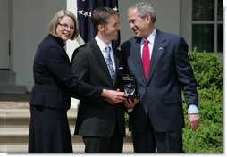 President George W. Bush smiles as he and Secretary of Education Margaret Spellings present Mike Geisen with the 2008 National Teacher of the Year honors Wednesday, April 30, 2008, in the Rose Garden of the White House. White House photo by Shealah Craighead