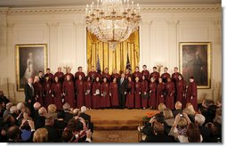 President George W. Bush stands on stage in the East Room of the White House with the Choir of Saint Patrick's Cathedral during a celebration of National Prayer Day Thursday, May 1, 2008.  White House photo by Joyce N. Boghosian