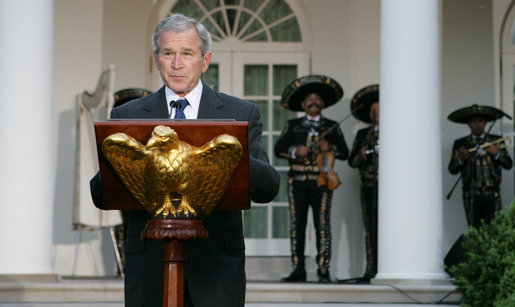 President George W. Bush welcomes guests to the Rose Garden Monday evening, May 5, 2008, for a social dinner in honor of Cinco de Mayo. White House photo by Chris Greenberg
