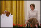 Mrs. Laura Bush smiles as the Westminster Kennel Club's 2008 Best in Show winner, Uno, is introduced to invited guests Monday, May 5, 2008, in the East Room during the beagle's visit to the White House Monday, May 5, 2008. White House photo by Shealah Craighead