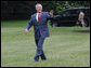 President George W. Bush smiles as he walks across the South Lawn to Marine One Thursday, May 8, 2008, en route to Andrews Air Force Base before continuing on to the Bush Ranch where he and Mrs. Laura Bush will celebrate the wedding of their daughter, Jenna, Saturday. White House photo by Joyce N. Boghosian