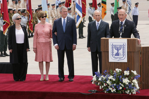 President George W. Bush and Mrs. Laura Bush are joined by Mrs. Aliza Olmert, wife of Prime Minister Ehud Olmert, and Israel’s President Shimon Peres as Israeli Prime Minister Olmert delivers remarks Wednesday, May 14, 2008, at arrival ceremonies for President and Mrs. Bush in Tel Aviv. White House photo by Chris Greenberg