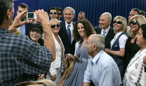 President George W. Bush and President Shimon Peres of Israel are surrounded by members of the media as they pose for photographs during their meeting Wednesday, May 14, 2008, at President Peres’ Jerusalem residence. White House photo by Joyce N. Boghosian