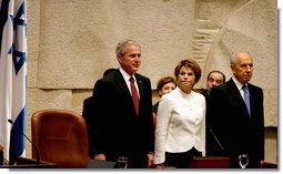 President George W. Bush stands with Dalia Itzik, Speaker of the Knesset, and Israel’s President Shimon Peres on the floor of the Knesset Thursday, May 15, 2008, in Jerusalem. During his remarks to the members of the Israel parliament, President Bush said, “We gather to mark a momentous occasion. Sixty years ago in Tel Aviv, David Ben-Gurion proclaimed Israel's independence, founded on the "natural right of the Jewish people to be masters of their own fate." What followed was more than the establishment of a new country. It was the redemption of an ancient promise given to Abraham and Moses and David -- a homeland for the chosen people Eretz Yisrael.” White House photo by Shealah Craighead