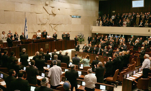 President George W. Bush receives a standing ovation by members of the Knesset Thursday, May 15, 2008, in Jerusalem. Acknowledging the 60th anniversary of Israel’s independence, the President told the Israeli parliament, “Earlier today, I visited Masada, an inspiring monument to courage and sacrifice. At this historic site, Israeli soldiers swear an oath: "Masada shall never fall again." Citizens of Israel: Masada shall never fall again, and America will be at your side.” White House photo by Shealah Craighead