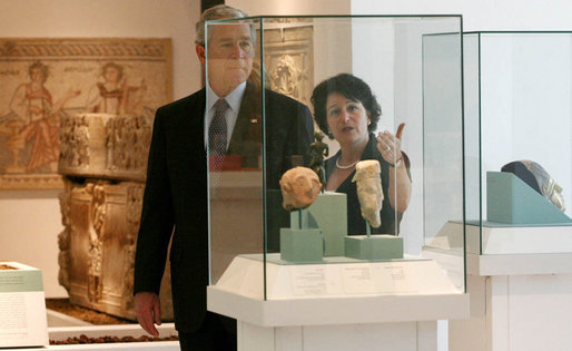 President George W. Bush listens as Amanda Weiss, Director of Bible Lands Museum Jerusalem describes and exhibit Friday, May 16, 2008, during a tour of the museum by the President and Mrs. Laura Bush. White House photo by Joyce N. Boghosian
