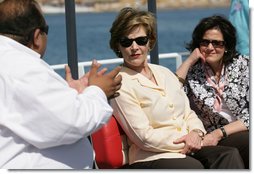 Mrs. Laura Bush and Mrs. Anita McBride, Assistant to the President and Chief of Staff to the First Lady, listen to Mr. Amir Ali, Hurghada Environmental Protection and Conservation Association, as they head out for a coral reefs and ocean conservation tour Saturday, May 17, 2008, in Sharm El Sheikh, Egypt. White House photo by Shealah Craighead