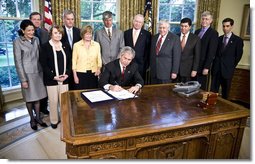 President George W. Bush signs H.R. 493, the Genetic Information Nondiscrimination Act of 2008, Wednesday, May 21, 2008, in the Oval Office. The Genetic Information Nondiscrimination Act would prevent health insurers from canceling, denying, refusing to renew, or changing the terms or premiums of coverage based solely on a genetic predisposition toward a specific disease. The legislation also bars employers from using individuals’ genetic information when making hiring, firing, promotion, and other employment-related decisions. White House photo by Eric Draper