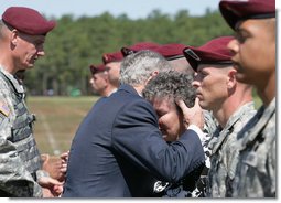 President George W. Bush embraces Barbara Walsh, mother of Sgt. First Class Benjamin Sebban, after receiving her son's posthumous Silver Star for gallantry presented by President Bush Thursday, May 22, 2008, during ceremonies at the 82nd Airborne Division Review in Fort Bragg, N.C. Sgt. First Class Sebban served valiantly as a Senior Medic in support of Operation Iraqi Freedom. White House photo by Chris Greenberg