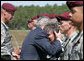 President George W. Bush embraces Barbara Walsh, mother of Sgt. First Class Benjamin Sebban, after receiving her son's posthumous Silver Star for gallantry presented by President Bush Thursday, May 22, 2008, during ceremonies at the 82nd Airborne Division Review in Fort Bragg, N.C. Sgt. First Class Sebban served valiantly as a Senior Medic in support of Operation Iraqi Freedom. White House photo by Chris Greenberg