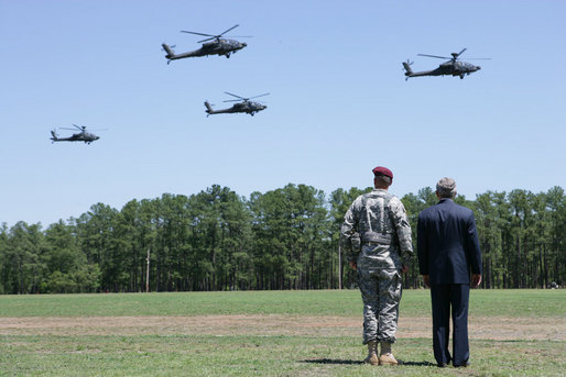 President George W. Bush, joined by Maj. Gen. David Rodriguez, watches a formation of helicopters fly pass during a troop review ceremony Thursday, May 22, 2008, during the President's visit to Fort Bragg, N.C. White House photo by Chris Greenberg