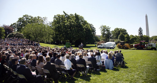 Speaking from the South Lawn with a backdrop of American-made products, President George W. Bush delivers remarks in recognition of World Trade Week Friday, May 23, 2008, at the White House. White House photo by Eric Draper