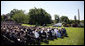 Speaking from the South Lawn with a backdrop of American-made products, President George W. Bush delivers remarks in recognition of World Trade Week Friday, May 23, 2008, at the White House. White House photo by Eric Draper