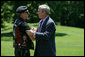 President George W. Bush greets Artie Muller, the National Executive Director of Rolling Thunder on the South Lawn of the White House. White House photo by Chris Greenberg