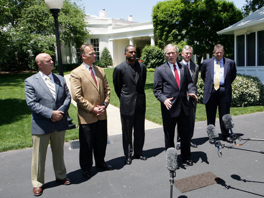 President George W. Bush speaks to reporters with NCAA head football coaches, from left to right, Jack Siedlecki of Yale University, Mark Richt of the University of Georgia, Randy Shannon of the University of Miami, Tommy Tuberville of Auburn University and Charlie Weis of the University of Notre Dame on Monday, May 26, 2008, at the White House. President Bush welcomed the coaches who were recently returning from visiting troops in the Middle East. White House photo by Chris Greenberg