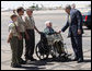 President George W. Bush greets four generations of Eagle Scouts, from right, Tom Boggess Jr., Tom Boggess III, Tom Boggess IV, and Tom Boggess V after arriving in Phoenix, Arizona, Tuesday, May 27, 2008. White House photo by Eric Draper