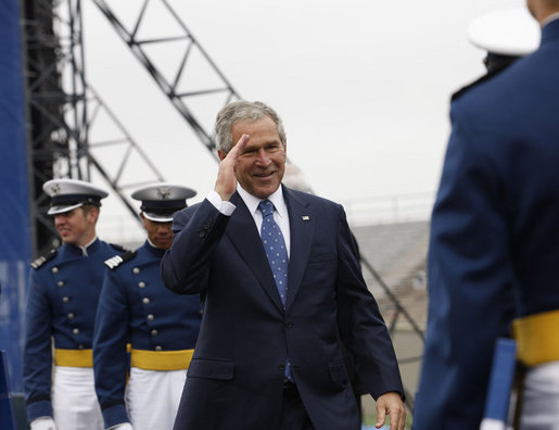 President George W. Bush salutes a graduate of the United States Air Force Academy during commencement exercises Wednesday, May 28, 2008, in Colorado Springs. Speaking to the 1,012 graduating cadets, the President said, "Each of you gathered here this morning has answered that same call. I want to thank you for stepping forward to serve. The security of our citizens and the peace of the world will soon be in your hands -- the best of hands. Be officers of character and integrity. Keep your wings level and true. Never falter; do not fail. And always know that America stands behind you." White House photo by Eric Draper