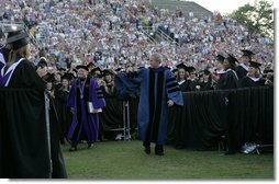 President George W. Bush walks through graduating seniors as he enters Paladin Stadium to give the commencement address to the Class of 2008 at Furman University in Greenville, SC.  White House photo by Chris Greenberg