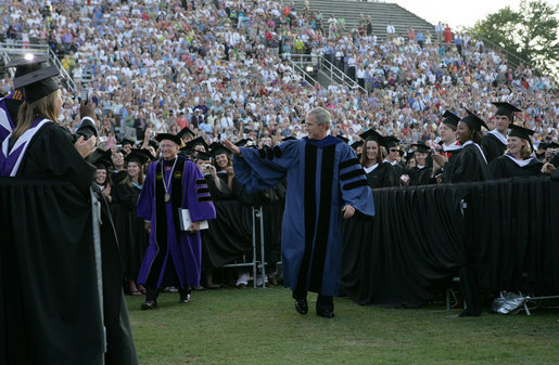 President George W. Bush walks through graduating seniors as he enters Paladin Stadium to give the commencement address to the Class of 2008 at Furman University in Greenville, SC. White House photo by Chris Greenberg