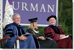 President George W. Bush shares a laugh with Furman University Student Commencement Speaker Meredith Neville and the Chairman of Furman University Board of Trustees Carl Kohrt during commencement ceremonies for the Class of 2008 at Furman University in Greenville, SC.  White House photo by Chris Greenberg