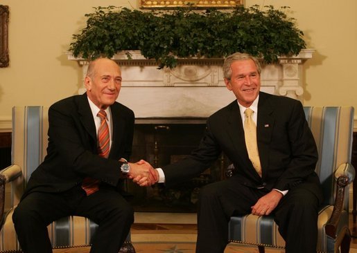 President George W. Bush and Prime Minister Ehud Olmert of Israel, shake hands during a photo opportunity prior to their meeting Wednesday, June 4, 2008, at the White House. White House photo by Joyce N. Boghosian