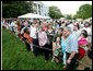 President George W. Bush poses for photos with some of the hundreds of guests attending the annual Congressional Picnic on the South Lawn of the White House, Thursday evening, June 5, 2008, for members of Congress and their families. White House photo by Chris Greenberg