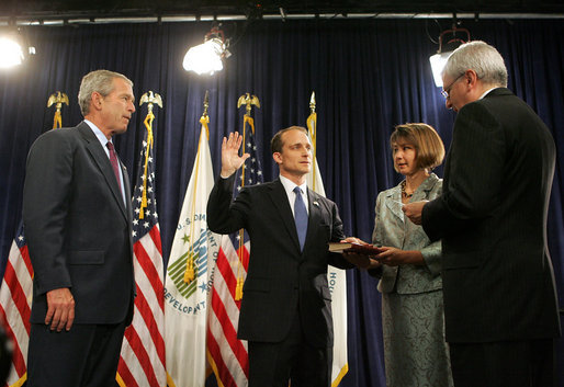 President George W. Bush looks on as White House Chief of Staff Joshua Bolten administers the oath of office to Secretary of Housing and Urban Development Steve Preston, Friday, June 6, 2008 in Washington, D.C. Holding the Bible for the ceremonial swearing-in is Molly Preston, wife of Secretary Preston. White House photo by Joyce N. Boghosian