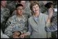 Mrs. Laura Bush poses for a photo with a US soldier during her visit to Bagram Air Force Base Sunday, June 8, 2008, in Bagram, Afghanistan. White House photo by Shealah Craighead