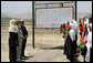 Mrs. Laura Bush is greeted by future students of the Ayenda Learning Center during her visit to the school's construction site Sunday, June 8, 2008, in Bamiyan, Afghanistan. Joining Mrs. Bush is Governor of Bamiran Province Habiba Sarabi, left, and Ihsan Ullah Bayat, who directed a tour of the site. White House photo by Shealah Craighead