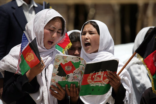 Students sing as they welcome Mrs. Laura Bush to the future site of the Ayenda Learning Center Sunday, June 8, 2008, in Bamiyan, Afghanistan. White House photo by Shealah Craighead