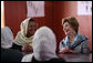 Mrs. Laura Bush smiles as she meets Sunday, June 8, 2008, with female graduates of the Police Training Academy in Bamiyan province in Afghanistan. With her is Bamiyan Governor Habiba Sarabi. White House photo by Shealah Craighead