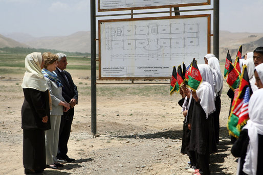 Mrs. Laura Bush is greeted by future students of the Ayenda Learning Center during her visit to the school's construction site Sunday, June 8, 2008, in Bamiyan, Afghanistan. Joining Mrs. Bush is Governor of Bamiran Province Habiba Sarabi, left, and Ihsan Ullah Bayat, who directed a tour of the site. White House photo by Shealah Craighead