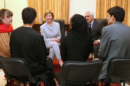 Mrs. Laura Bush is joined by Afghan Foreign Minister Rangeen Dadfar Spanta, center right, for a meeting with Afghan teachers and students, Sunday, June 8, 2008, during an unannounced visit to Kabul. Attending the meeting were representatives from Kabul University, American University of Afghanistan, International School of Kabul and the Women's Teacher Training Institute. White House photo by Shealah Craighead